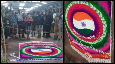 થાણે સ્ટેશને બનાવવામાં આવેલી રંગોળી અને તેની તસવીરો લેતાં લોકો