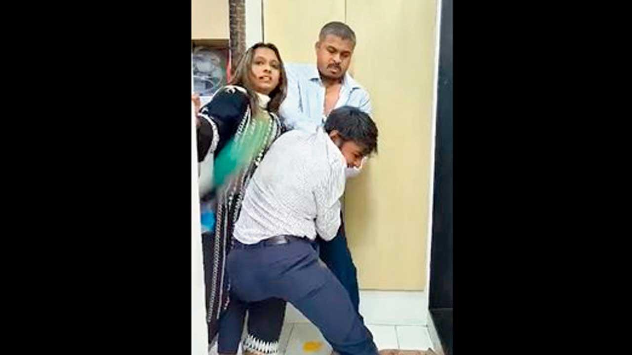 ગુજરાતી દંપતીની મારપીટ થતી હોવાની તસવીર. 