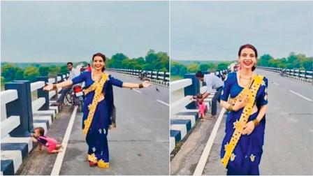 બાળક ભાંખોડિયાં ભરીને બ્રિજના કિનારે પહોંચી ગયું પણ મા રીલ બનાવતી રહી
